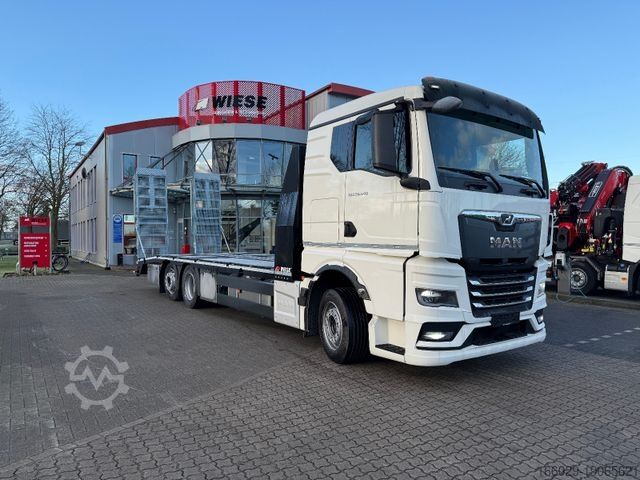 Бортовой грузовик MAN Baumaschinen-  Arbeitsbühnentransporter Rampen