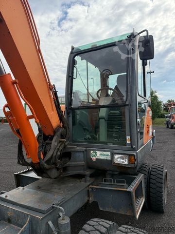Колёсный экскаватор DOOSAN DX 55 W / gepflegt / 4.450 Bh