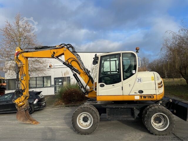 Мобильный экскаватор Schaeff TW110 inkl.Powertilt & Greifer