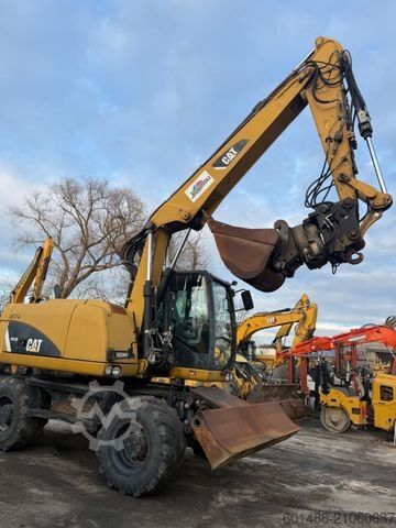Колёсный экскаватор CATERPILLAR M313D