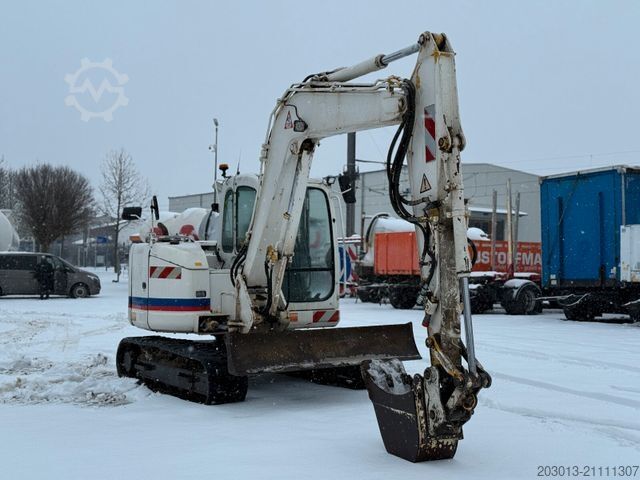 Колёсный экскаватор NEW HOLLAND E80 BMSR-2 Kettenbagger 8,6 Tonnen *Greifer
