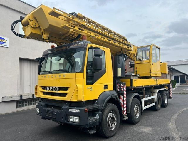 Кран-манипулятор на шасси грузовика IVECO Trakker 410 Dachdecker 36m MKG HMK 851 TA A2A2